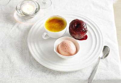 Muscat creme brulee with poached plums and plum sorbet
