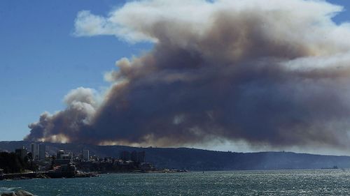 View of smoke from a forest fire in Valparaiso. (AAP)