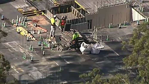 A construction worker in St Ives, in Sydney's north, was taken to hospital with head and chest injuries today after a fall on-site. Picture: 9NEWS.