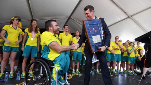 Gold medalist Kurt Fearnley of Australia during the medal ceremony for the T54 Marathon during the XXI Commonwealth Games on the Gold Coast. Picture: AAP