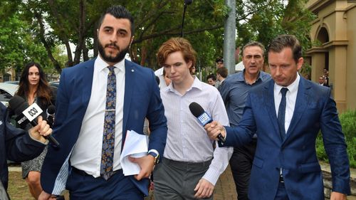 Luke Munday (centre) leaves the Camden Local Court in Sydney, Thursday, December 13, 2018. 