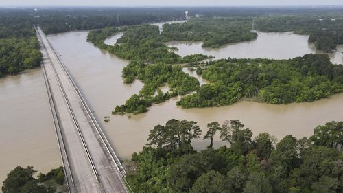 The bridge over Lake Houston along West Lake Houston Parkway from Kingwood to Atascocita is seen after it was closed due to high water on either side of the thoroughfare, Saturday, May 4, 2024, in Kingwood, Texas. (Jason Fochtman/Houston Chronicle via AP)