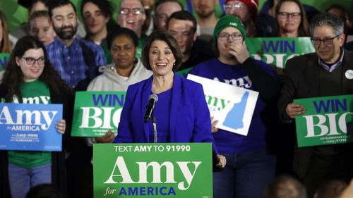 Amy Klobuchar grins after coming third in the New Hampshire primary.