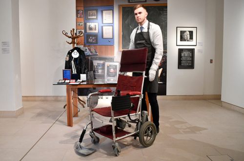 The motorised chair, used by Hawking after he was paralysed with motor neuron disease, raised 296,750 pounds in a Christie's online auction. 