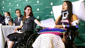 Circus acrobat Julissa Segrera, second from right, of the United States, and Dayana Costa, right, of Brazil, are tearful as Ms Costa reads a statement at Spaulding Rehabilitation Hospital in Boston. They were among the eight acrobats injured when the apparatus from which they were suspended fell, sending them plummeting to the ground during a performance.