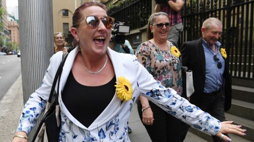 Jodie's sister Tracey Smith celebrates outside court. (AAP)