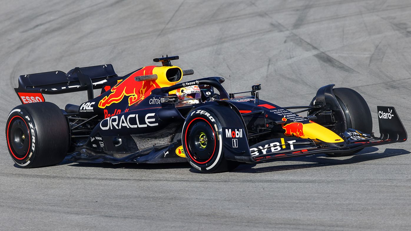 Max Verstappen behind the wheel of the Red Bull, featuring radical sidepods.