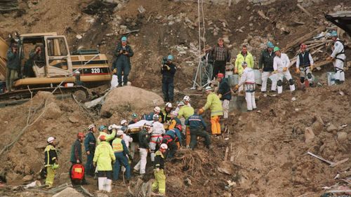 Rescuers carry Stuart Diver from the site of the Thredbo landslide in this 1997 photo.