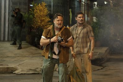 This image released by Apple TV+ shows Russell Crowe, left, and Zac Efron in a scene from The Greatest Beer Run Ever.