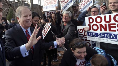 Democrat Doug Jones greets supporters in Mountain Brook, Alabama. (AAP)