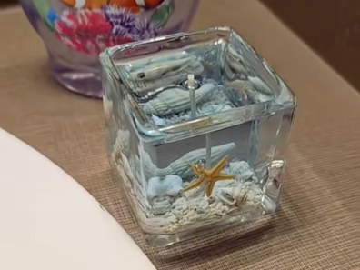 Ocean gel candle sitting on a bathroom counter