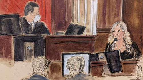 This courtroom sketch shows presiding Judge Jesse Furman, left, listening as Stormy Daniels testifies in her lawsuit trial against Michael Avenatti.