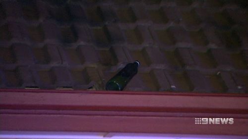 A second bottle was thrown onto Ms Baxter's roof. (9NEWS)