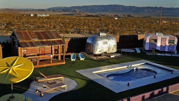 The sun sets on the Hicksville Trailer Palace in Joshua Tree