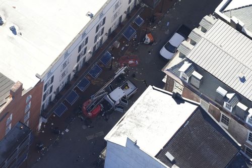 Investigators work the scene after a person drove a vehicle into a crowd earlier on Canal and Bourbon Street in New Orleans, Wednesday, Jan. 1, 2025.