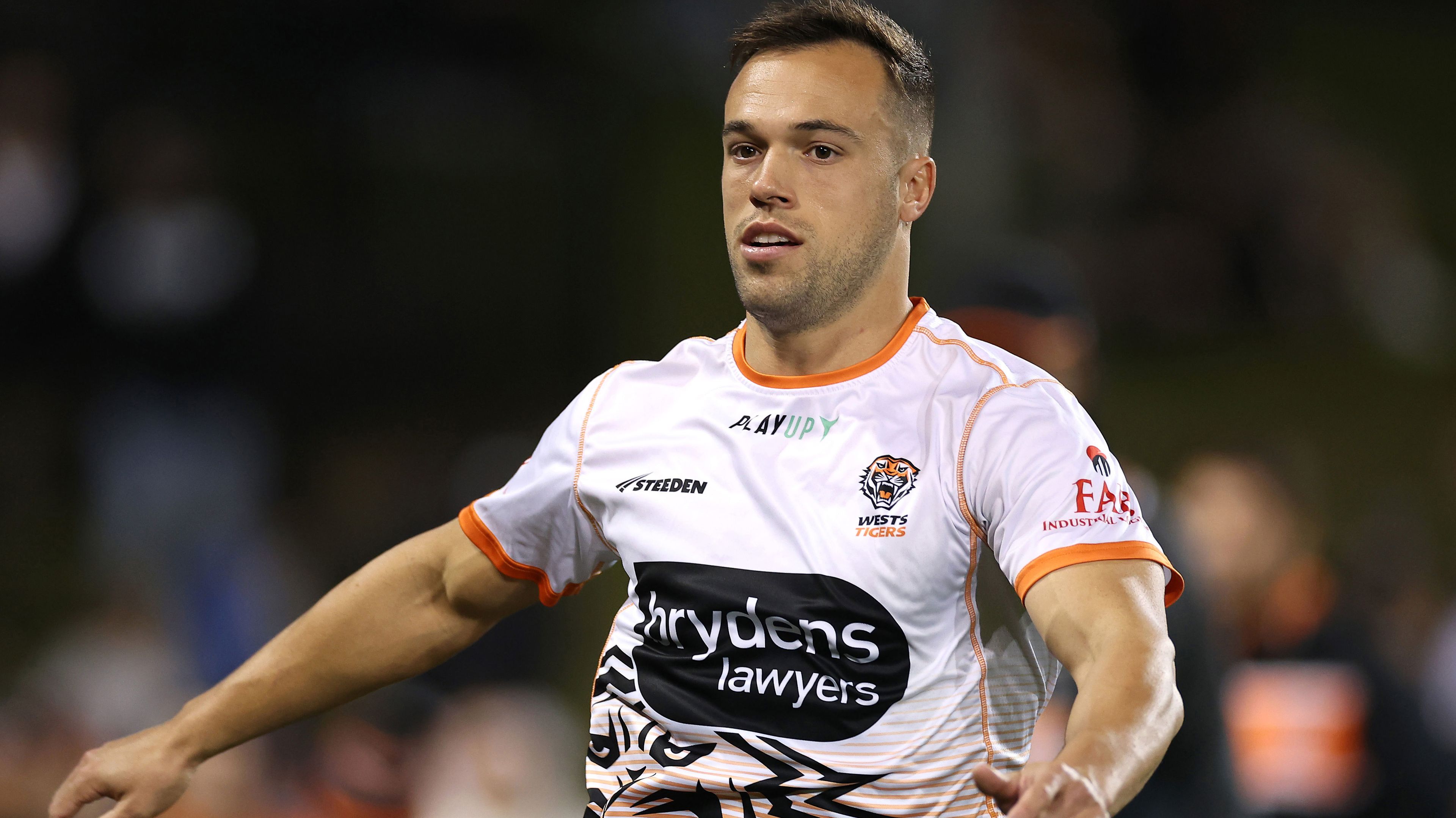 Luke Brooks warms up before the Wests Tigers&#x27; round match against the Canberra Raiders.