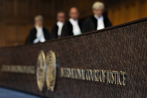 Judges enter the International Court of Justice, in The Hague, Netherlands, Thursday, May 16, 2024. 
