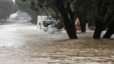 Floodwater inundate cars in Lismore as heavy rain batters the Northern Rivers region of NSW.