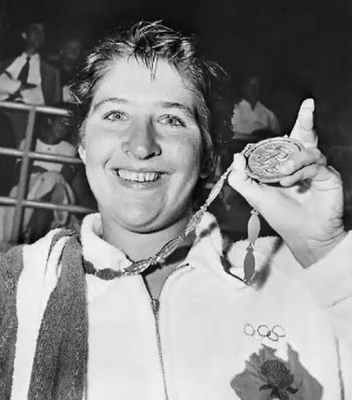 Fraser shows off a gold medal from the 1960 Rome Olympics. (Source: Getty)

