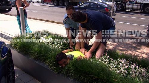 An off-duty firefighter came to help in the arrest of an allegedly drunk truckie.