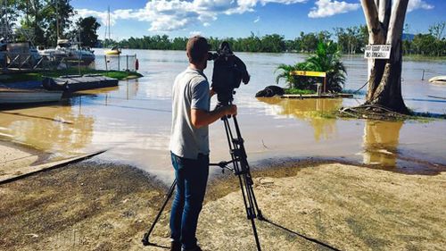 Tom Pawson films the Fitzroy River rise. (Image: 9NEWS)