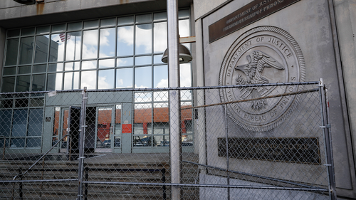 Fencing stands outside the main entrance of the Metropolitan Detention Center, Brooklyn where British socialite Ghislaine Maxwell is held, Tuesday, July 14, 2020, in New York. 