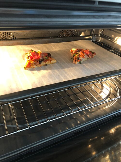 Reheating pizza slices in an oven