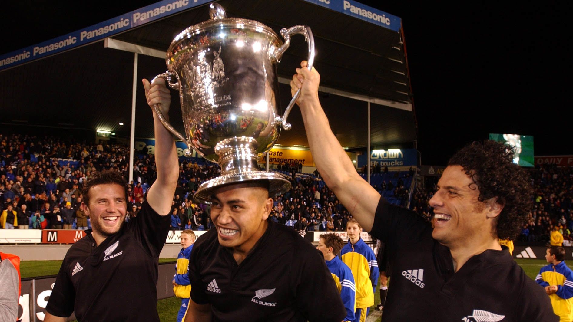 All Blacks Aaron Mauger, Jerry Collins and Doug Howlett celebrate with the Bledisloe Cup.
