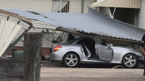 A Queensland woman has recounted the terrifying moment an out-of-control and allegedly stolen car ploughed into her home.