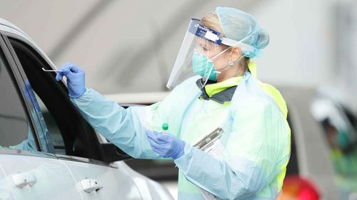 Medical professionals conduct a nasal swab test at the COVID-19 Bondi Beach drive-through testing centre.