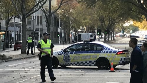 A heavy police presence remains in the surrounding area as roads are closed and traffic mounts. Picture: 9NEWS/Sean Davidson.