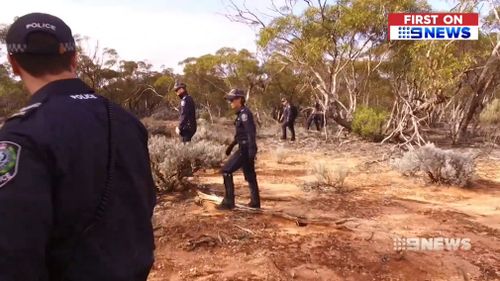 Detectives performed line searches in dense outback shrubbery in an attempt to find Redman.