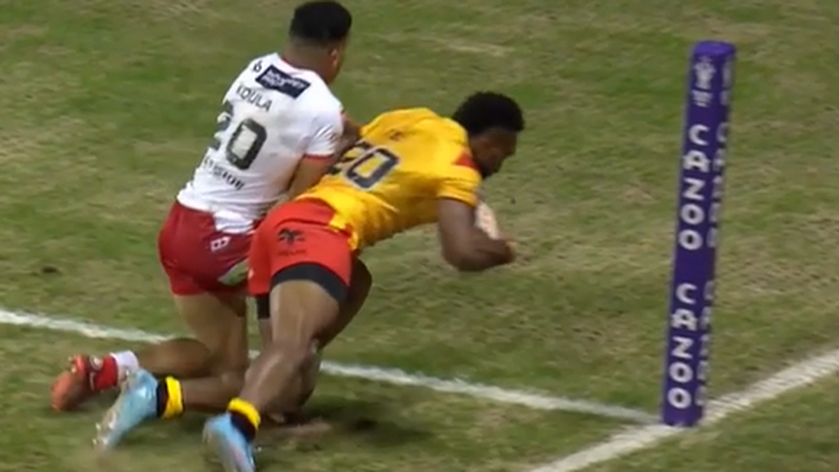 Tonga's Will Penisini scores a try during the Rugby League World