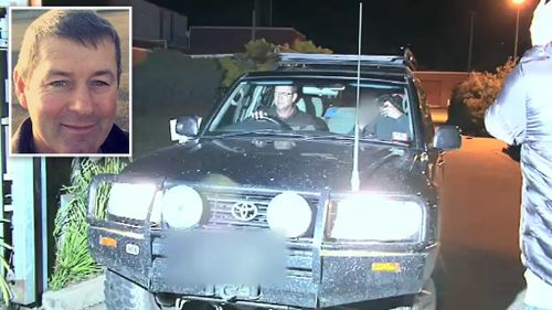 Mark Tromp made an obscene gesture as he was driven out of the Wangaratta police station. (9NEWS)