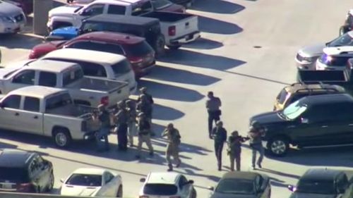 Aerial shots show police in the car park. (Supplied)