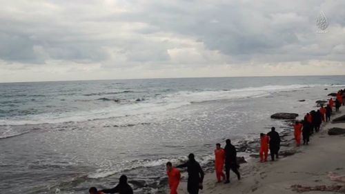 The Christians are seen being led down a Tripoli beach before being brutally murdered. (Supplied)