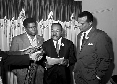 James Foreman, executive secretary of the Student Non-violent Coordinating Committee, left, Civil Rights leader Dr. Martin Luther King Jr., center, head of the Southern Christian Leadership Conference and activist-singer Harry Belafonte appear during a press conference in Atlanta on April 30, 1965