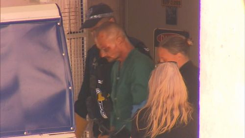 Accused mass murderer Ben Hoffman leaves hospital after surgery for knife wounds.