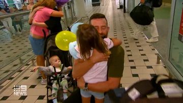 Jason Marrable returned to Brisbane airport with his family in toe after a week rescue mission in Ukraine. 