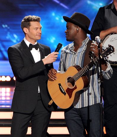 Ryan Seacrest and C.J. Harris onstage during Fox's "American Idol" XIII Finale at Nokia Theatre L.A. Live on May 21, 2014 in Los Angeles, California.