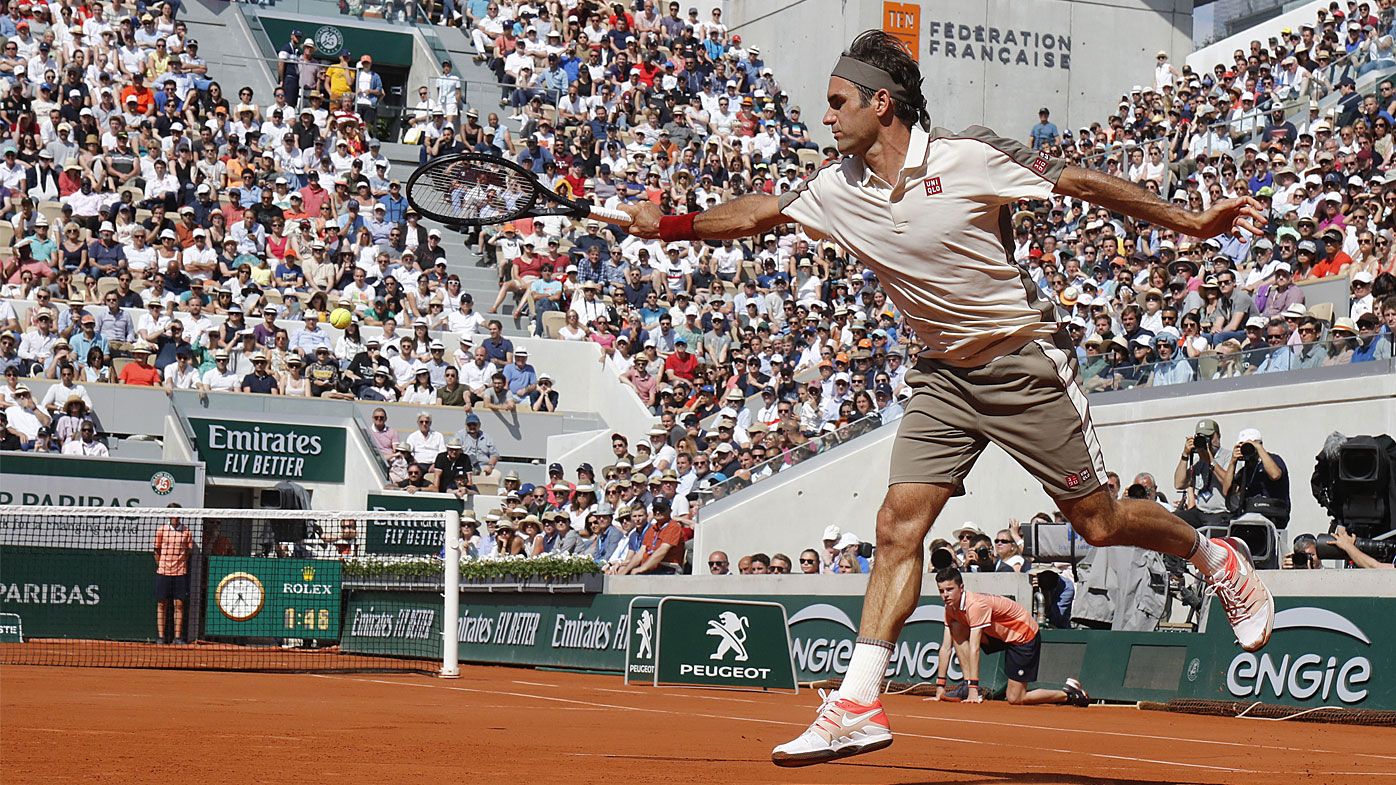 Roger Federer sets grand slam record, Rafael Nadal marches on