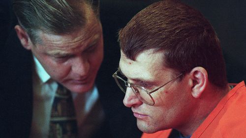 Accused murderer Keith Hunter Jesperson, dubbed the Happy Face Killer, right, listens to his attorney Tom Phelan moments before pleading guilty to murder charges Wednesday, October 18, 1995.