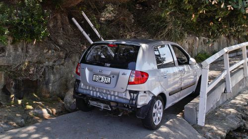 The car is understood to have fallen about five metres. (AAP)