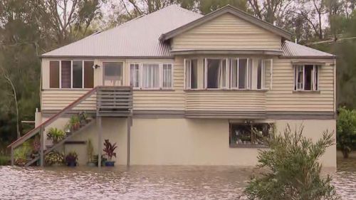 Queensland residents face a mammoth clean-up after﻿ a downpour inundated homes.