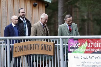 King Charles III, second from right, visits the Aboyne and Mid Deeside Community Shed to meet with local hardship support groups and tour the new facilities, in Aboyne, Aberdeenshire, Scotland, Thursday, Jan. 12, 2023 