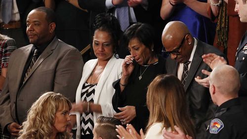 Robert Mickens, Evelyn Rodriguez Elizabeth Alvarado and Freddy Cuevas react as US President Donald J. Trump talks about the murder of their daughters. (AAP)