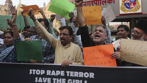 Activists shout slogans demanding justice in the case of a veterinarian who was gang-raped and killed last week during a protest in Mumbai, India, Monday, Dec. 2, 2019.