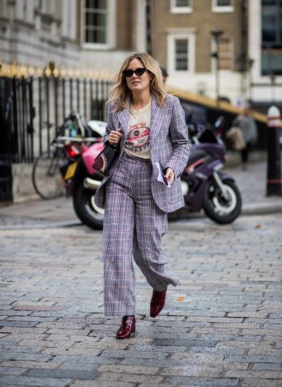 Lucy Williams updated her man-style suit with a rock god T-shirt and seriously stylish shades.