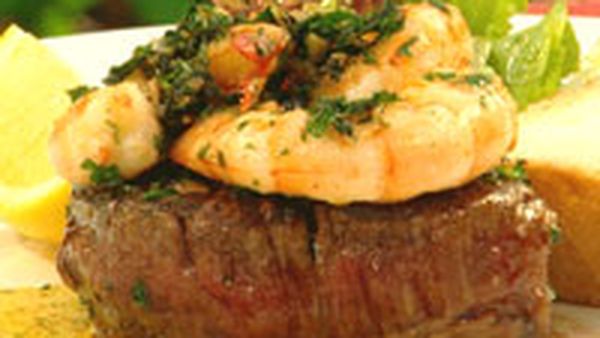 Beef fillet with garlic and herb prawns