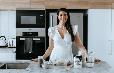 Stephanie Rice in the kitchen making a recipe with PranaOn plant based protein powder